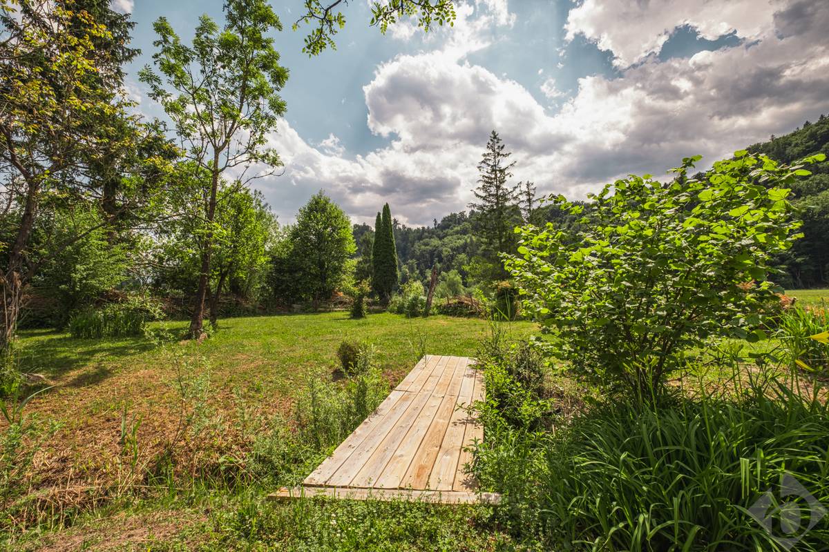 Bach, Biotop und viel Natur: Einfamilienhaus mit Einliegerwohnung und Erweiterungspotenzial in Adnet - Ansicht 2