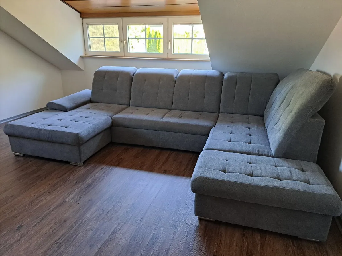 Große Eckcouch mit Bettfunktion - grau - bereits abgebaut, € 520,- (5121 Ostermiething)