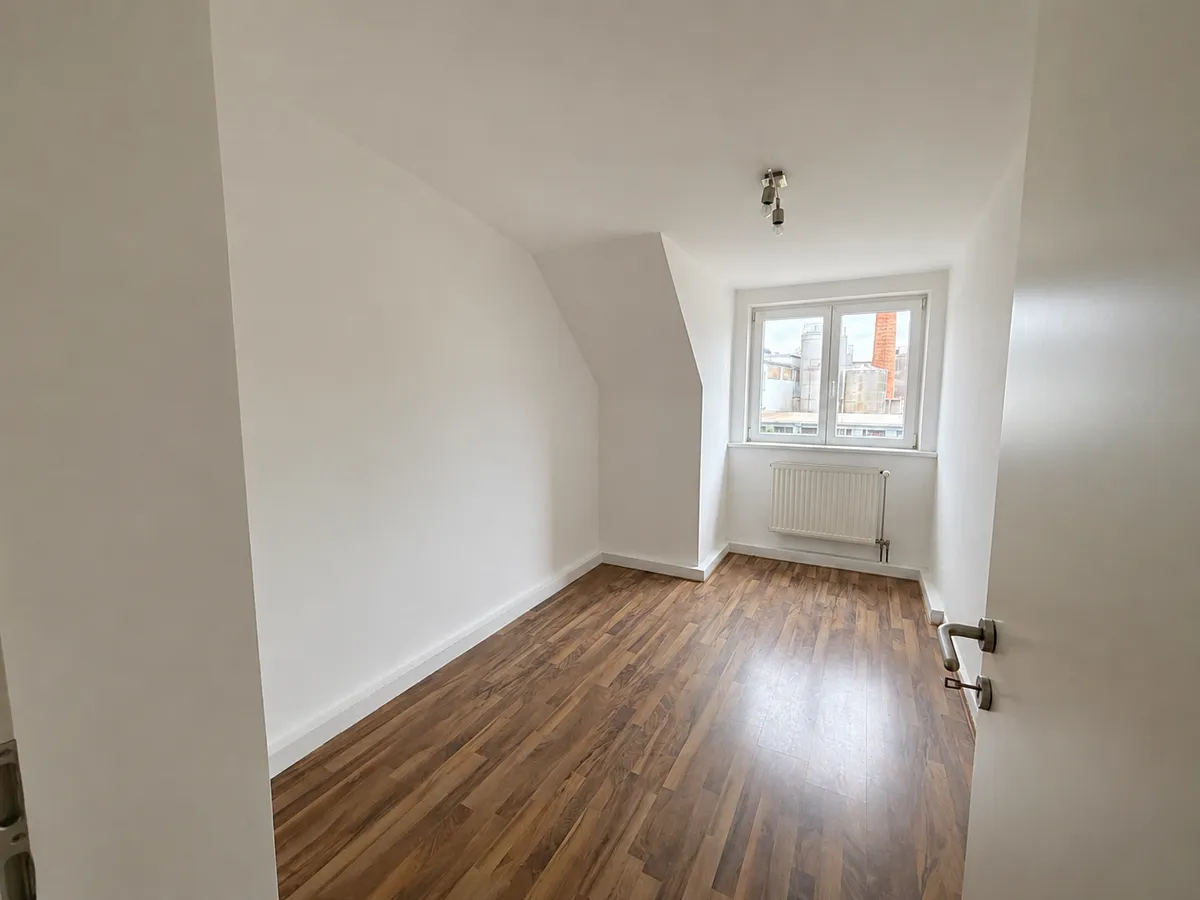 Ankommen und wohlfühlen: Gemütliche Dachgeschosswohnung in zentraler Lage - Ansicht 3