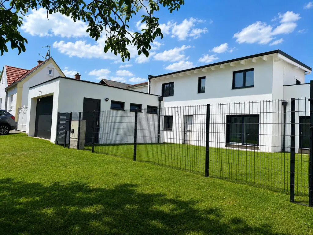 Wohnen mit Stil in Sigleß - Garage, Garten und Dachterrasse inklusive - Ansicht 2
