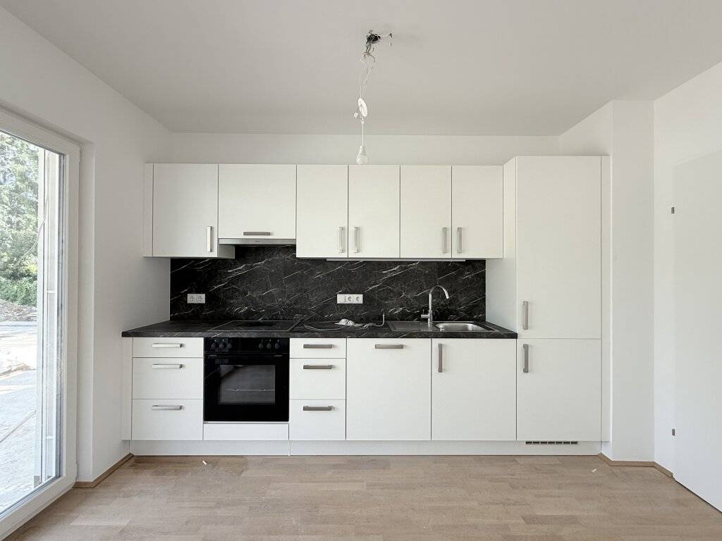 Erstbezug! Schöne Dreizimmerwohnung mit Garten - Ansicht 2