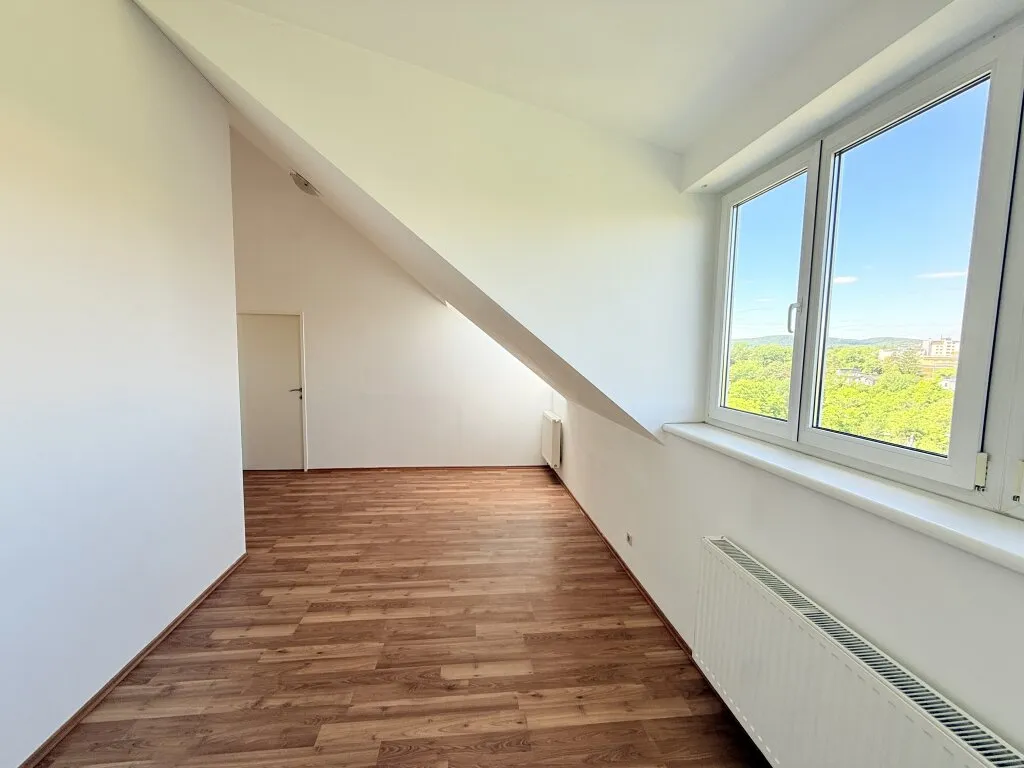 Charmante 3-Zimmer Dachgeschosswohnung mit Top-Anbindung an die Öffis - Ansicht 2
