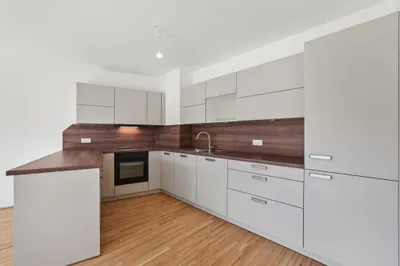 Moderne Erstbezug-Mietwohnungen mit privaten Freiflächen und Garage im 21. Bezirk – Bild 3