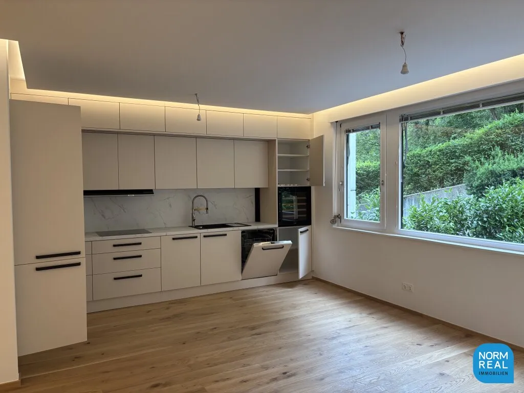 Erstbezug: Elegante Gartenwohnung mit Outdoor Pool - Ansicht 3