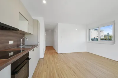 Moderne Erstbezug-Mietwohnungen mit privaten Freiflächen und Garage im 21. Bezirk – Bild 2