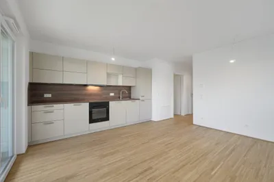 Moderne Erstbezug-Mietwohnungen mit privaten Freiflächen und Garage im 21. Bezirk – Bild 3