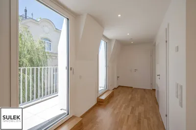Klimatisierte Dachgeschosswohnung mit Büroraum & 16 m² Balkon | VILLMA - Top 6