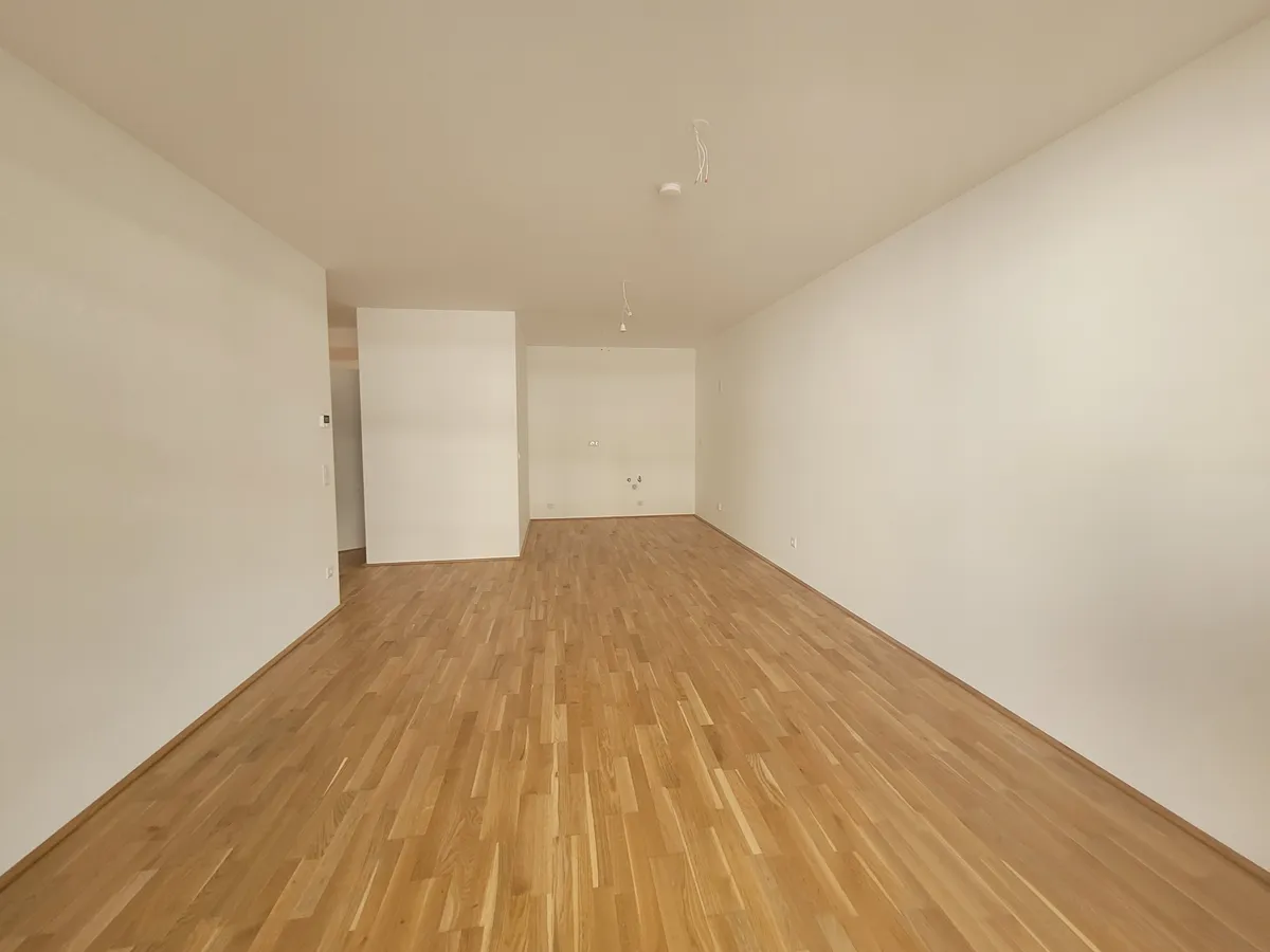 3-Zimmer-Erstbezug mit Küche, Balkon und Tiefgarage - Ansicht 2