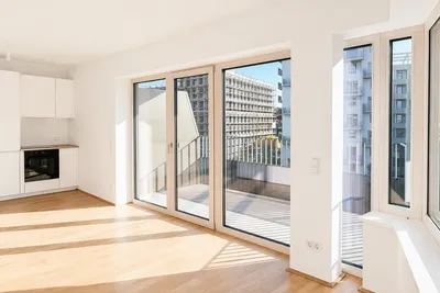 Lichtdurchflutete und moderne 2-Zimmer-Wohnung mit Parkblick, großem Balkon und Deckenkühlung – Bild 2