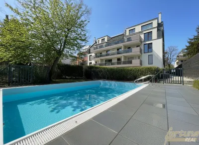 Moderne 3-Zimmer-Mietwohnung mit Balkon, Kühlfunktion, beheiztem Pool & Tiefgarage