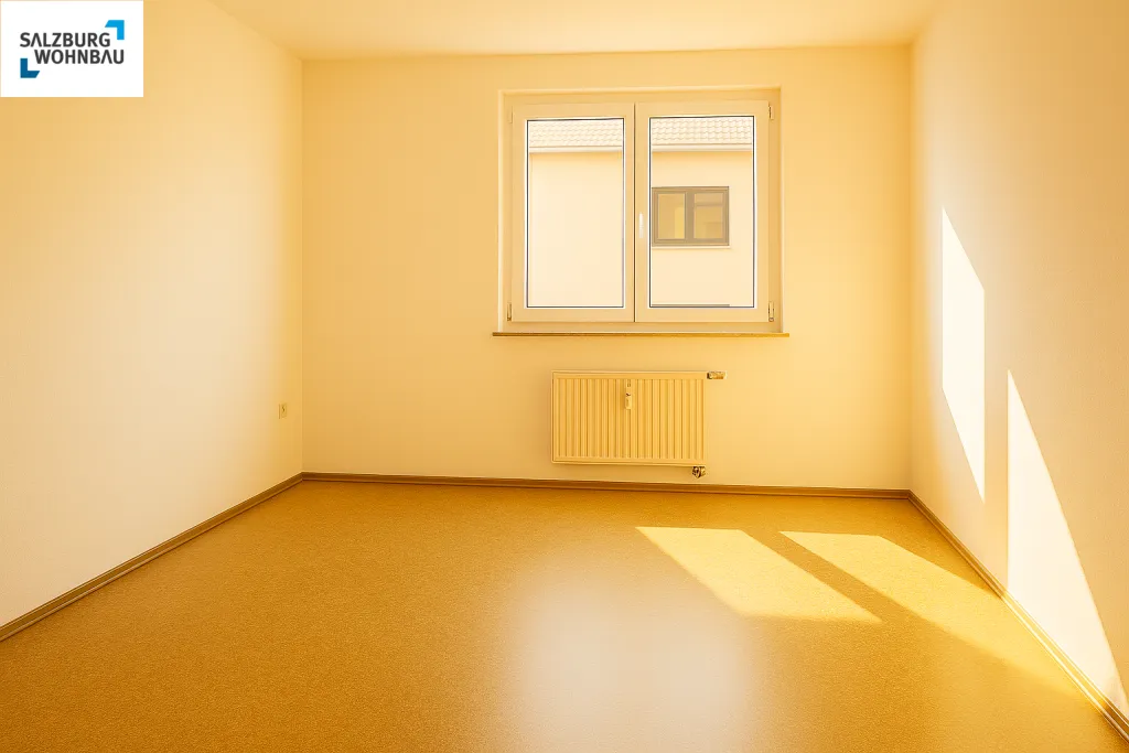 HEIMELIG IN ST. JOHANN! Sonnige, große, geförderte 2-Zimmerwohnung in St. Johann mit Balkon und Tiefgaragenplatz! Hohe Wohnbeihilfe möglich - Ansicht 3