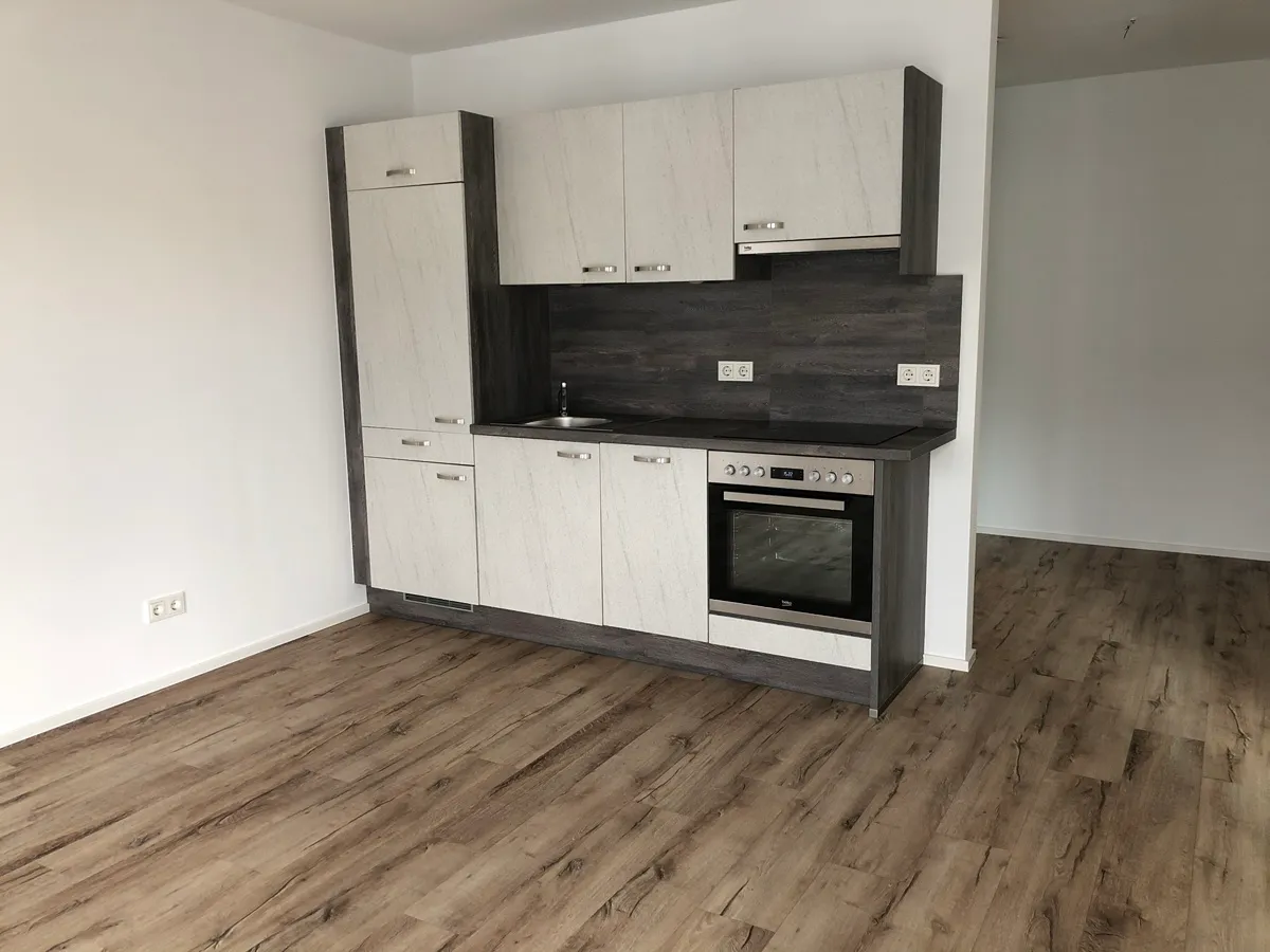 Hochwertige Wohnung im Zentrum mit Tiefgaragenstellplatz und Kellerabteil - Ansicht 3