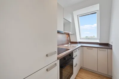 Moderne Erstbezug-Mietwohnungen mit privaten Freiflächen und Garage im 21. Bezirk – Bild 3