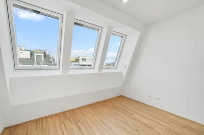 Moderne Erstbezug-Mietwohnungen mit privaten Freiflächen und Garage im 21. Bezirk – Bild 2