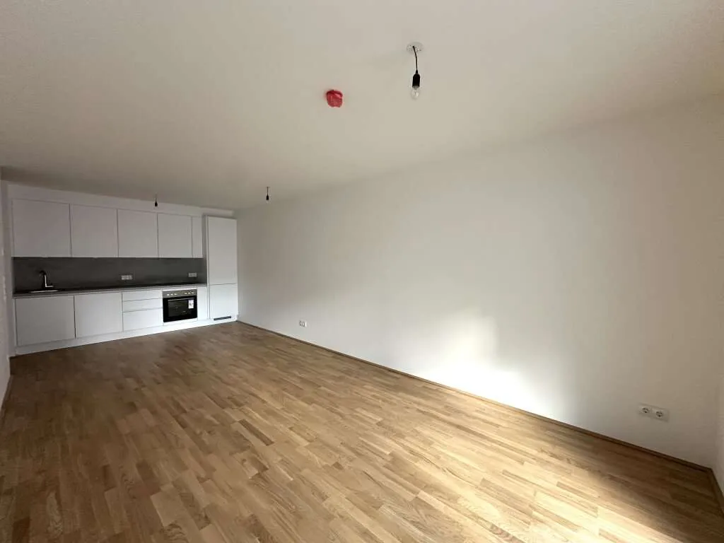 JETZT INVESTIEREN! Erstbezugstraum in ruhiger Lage - 3 Zimmer inkl. Küche und südseitigem Balkon - Ansicht 2