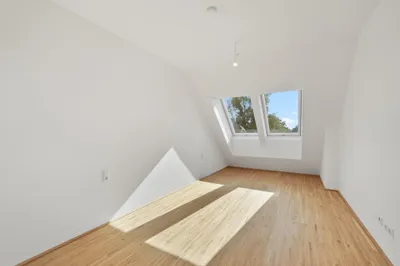 Moderne Erstbezug-Mietwohnungen mit privaten Freiflächen und Garage im 21. Bezirk – Bild 3