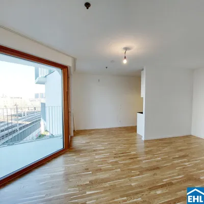 Sonnwendviertel: 1-Zimmer-Wohnung mit Balkon im 16. OG - Fitnessraum, Co-Working & Rooftop-Terrasse inklusive!