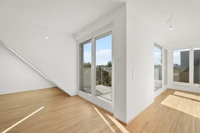 Moderne Erstbezug-Mietwohnungen mit privaten Freiflächen und Garage im 21. Bezirk – Bild 2